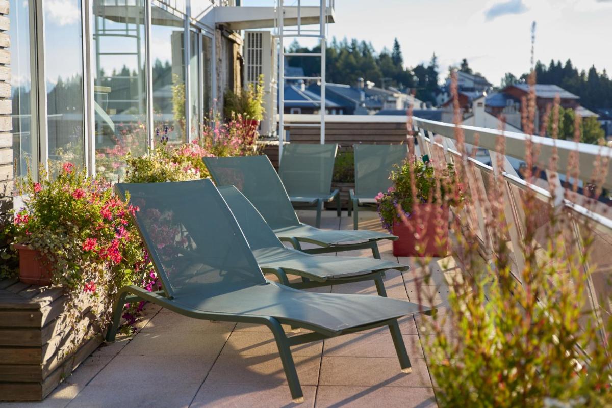 Balcon ou terrasse dans l'établissement Hôtel Le Grand Tétras