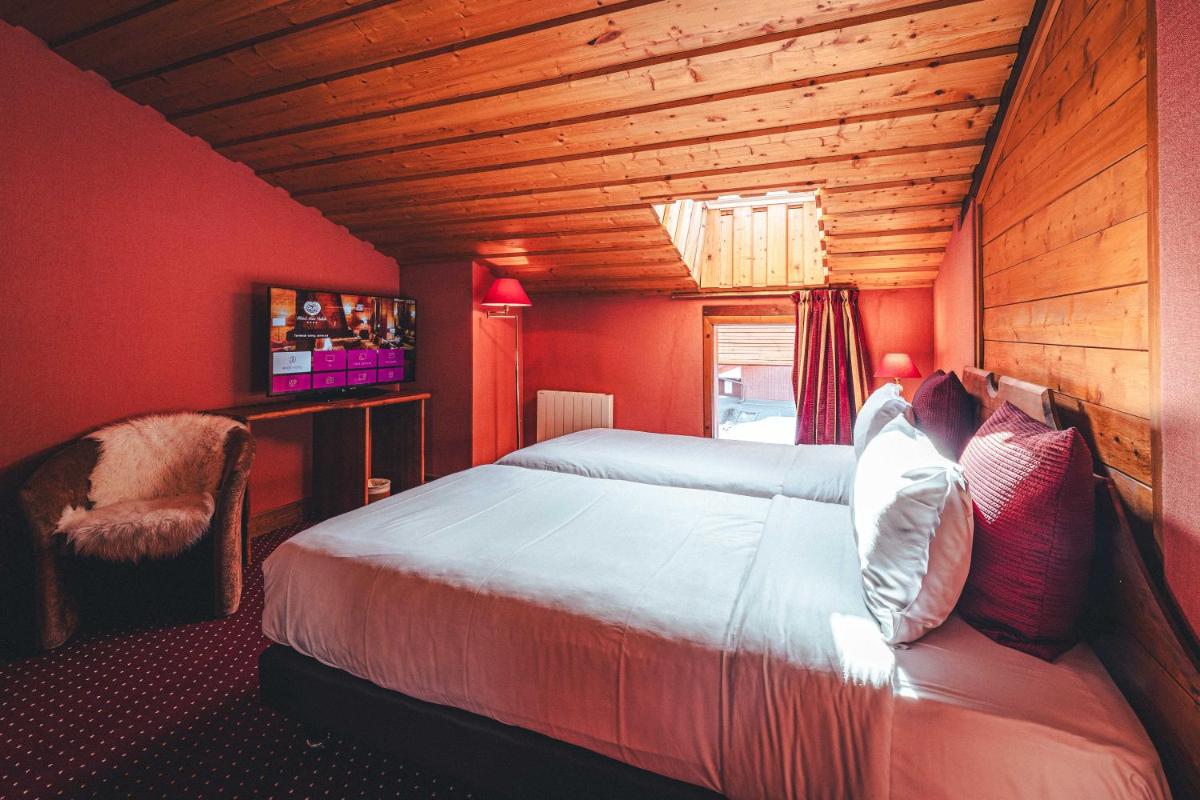 Un ou plusieurs lits dans un hébergement de l'établissement Hotel Mont Vallon