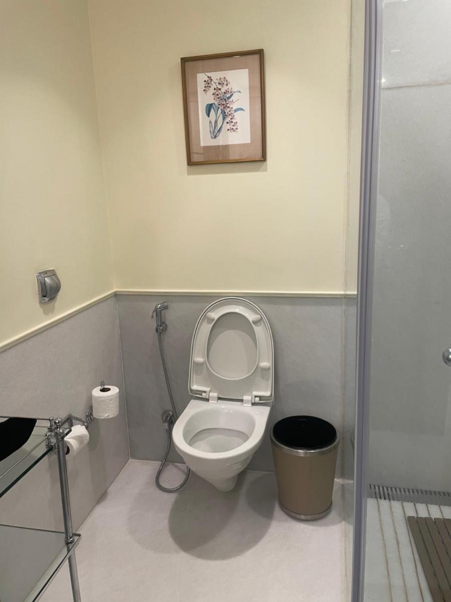 a bathroom with a toilet with the lid up at ITC Maurya, a Luxury Collection Hotel, New Delhi in New Delhi a bathroom with a toilet with the lid up at ITC Maurya, a Luxury Collection Hotel, New Delhi in New Delhi