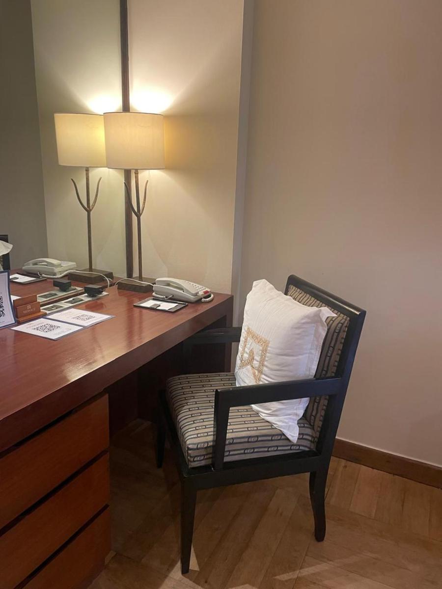 a office with a desk with a chair and a phone at ITC Maurya, a Luxury Collection Hotel, New Delhi in New Delhi a office with a desk with a chair and a phone at ITC Maurya, a Luxury Collection Hotel, New Delhi in New Delhi