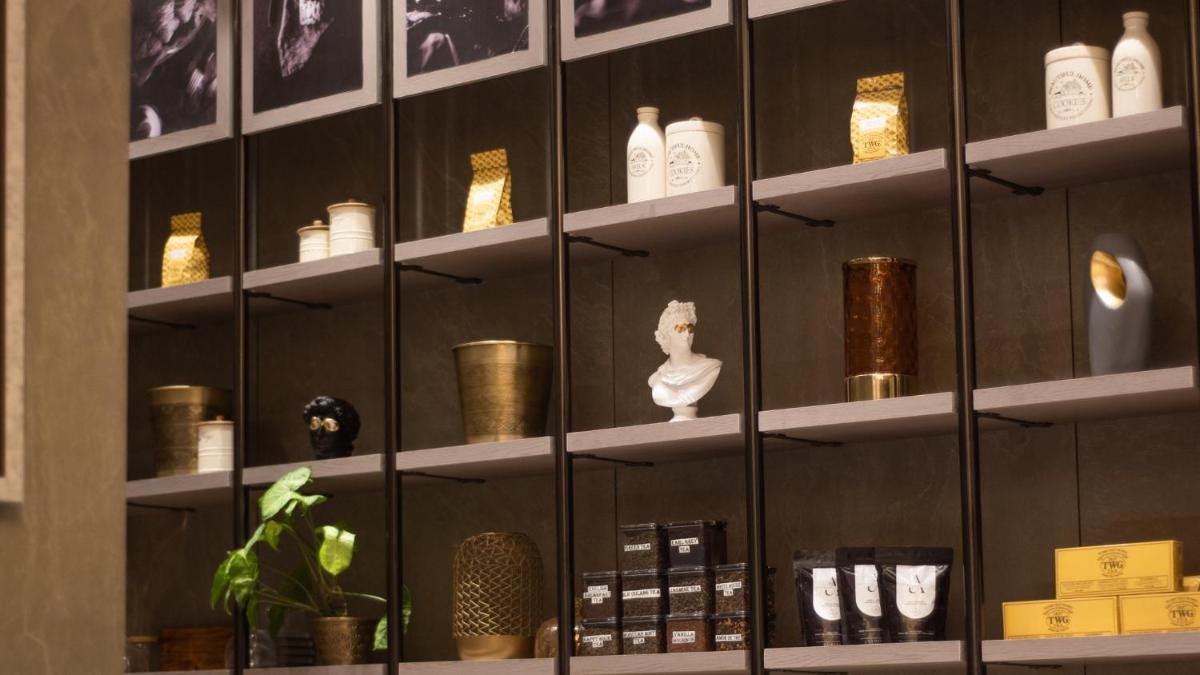 a shelf with vases and other items on it at Crowne Plaza Today Gurugram by IHG in Gurgaon