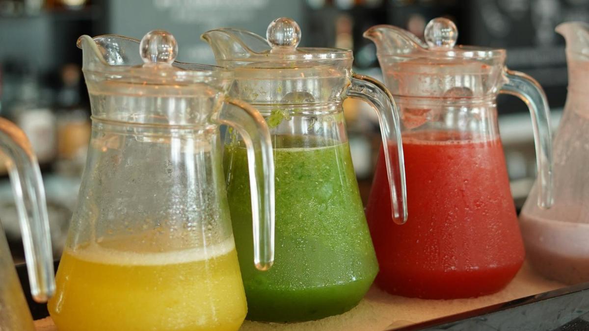three glass containers filled with different colored liquid at InterContinental Marine Drive Mumbai by IHG in Mumbai