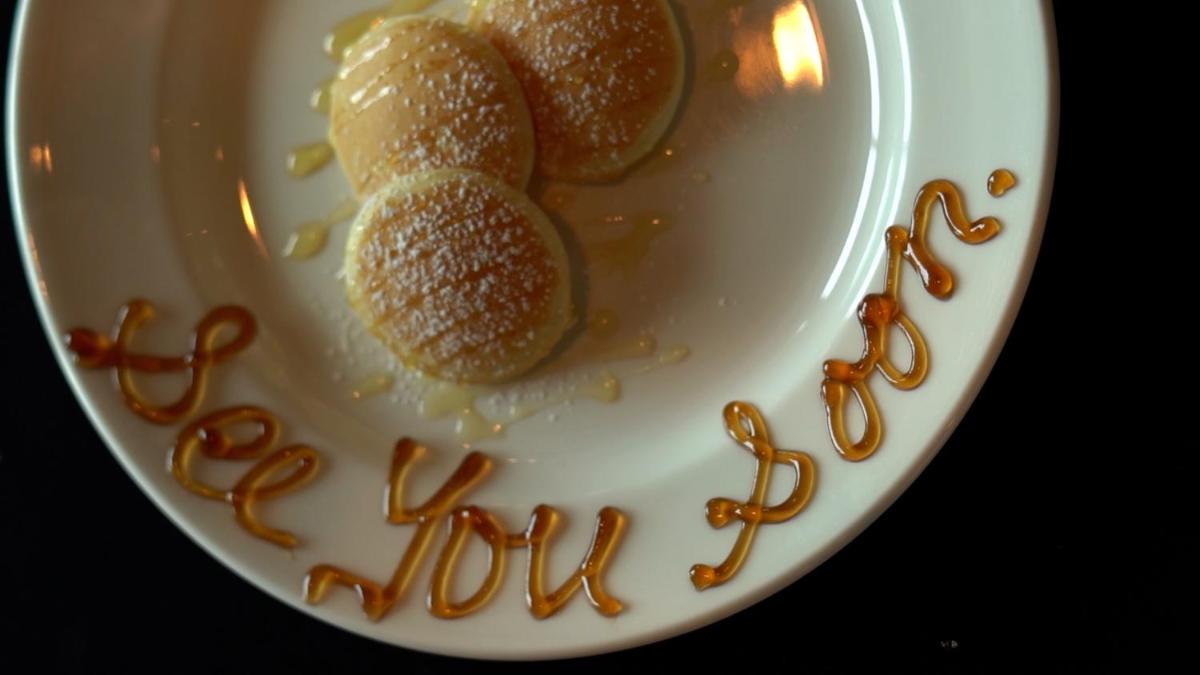 a plate with two donuts with the words troll on it at InterContinental Marine Drive Mumbai by IHG in Mumbai