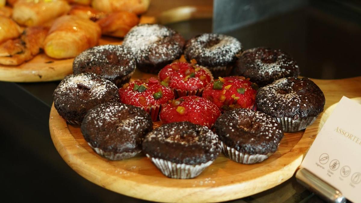 a plate of chocolate and strawberry muffins on a table at InterContinental Marine Drive Mumbai by IHG in Mumbai
