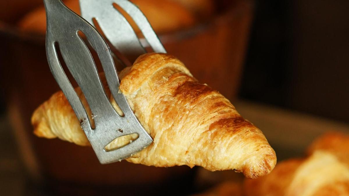 a piece of bread with a fork and a knife at InterContinental Marine Drive Mumbai by IHG in Mumbai