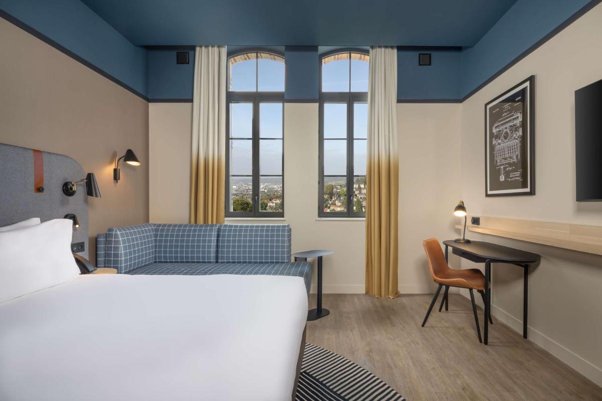 Un ou plusieurs lits dans un hébergement de l'établissement Hyatt Place Rouen