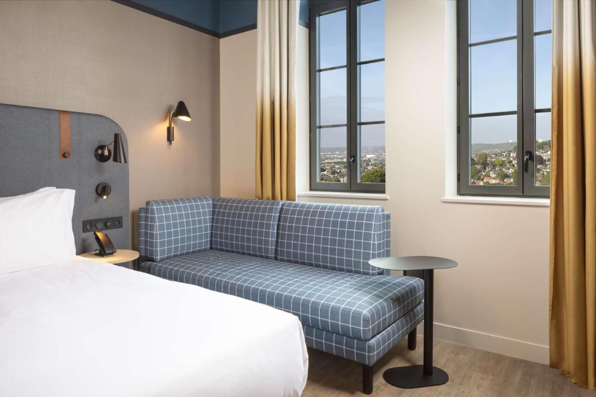 Un ou plusieurs lits dans un hébergement de l'établissement Hyatt Place Rouen