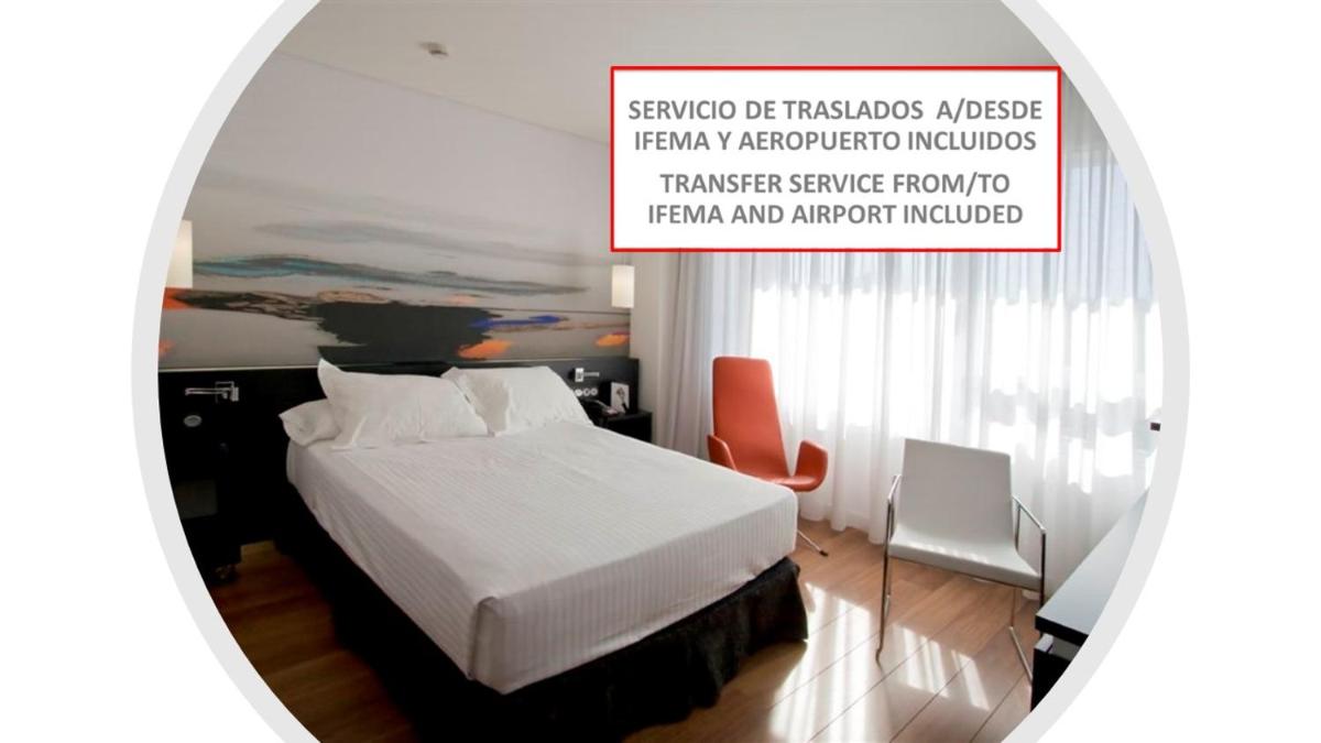 Cama o camas de una habitación en Axor Barajas