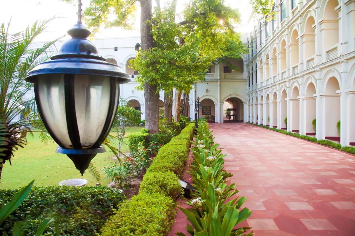 a street light next to a building with a walkway at The Grand Imperial - Heritage Hotel in Agra