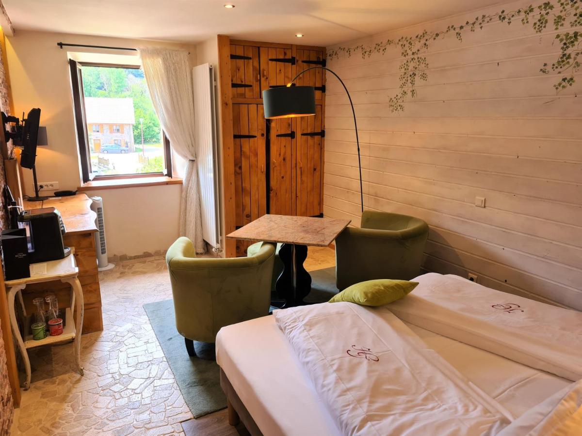 Un ou plusieurs lits dans un hébergement de l'établissement Domaine du Haut Jardin Hôtel & Chalets Spa Privé