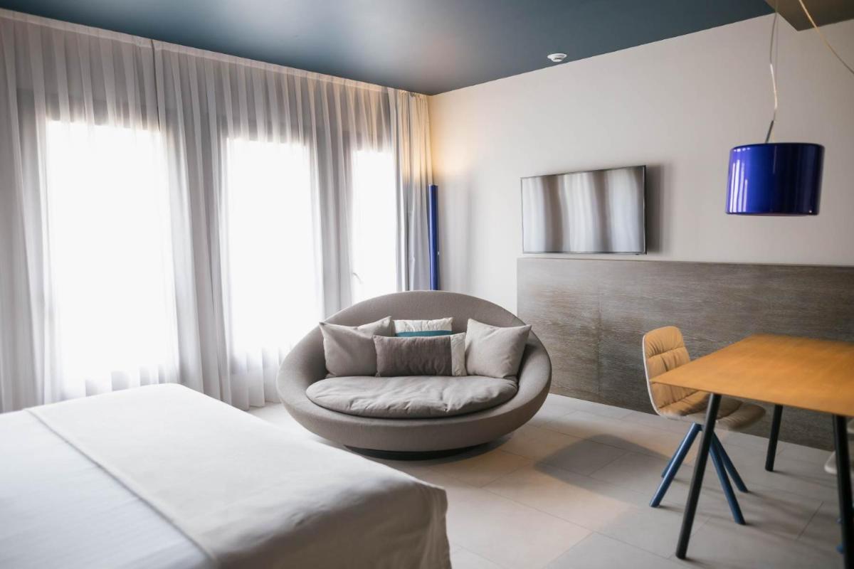 Cama o camas de una habitación en MYR Plaza Mercado & Spa
