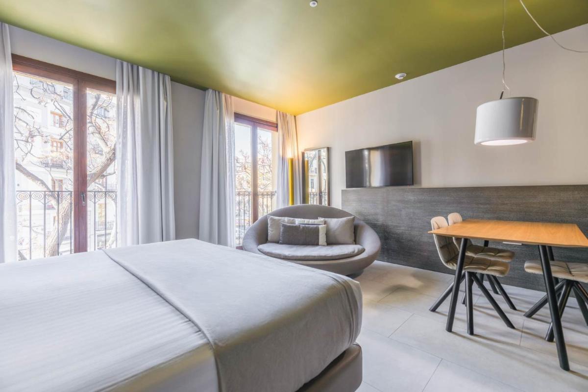 Cama o camas de una habitación en MYR Plaza Mercado & Spa