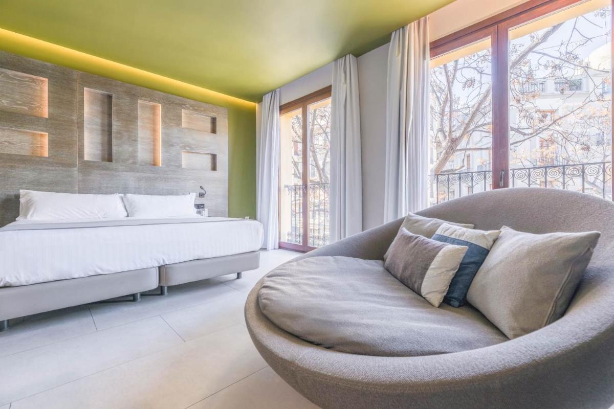 Cama o camas de una habitación en MYR Plaza Mercado & Spa