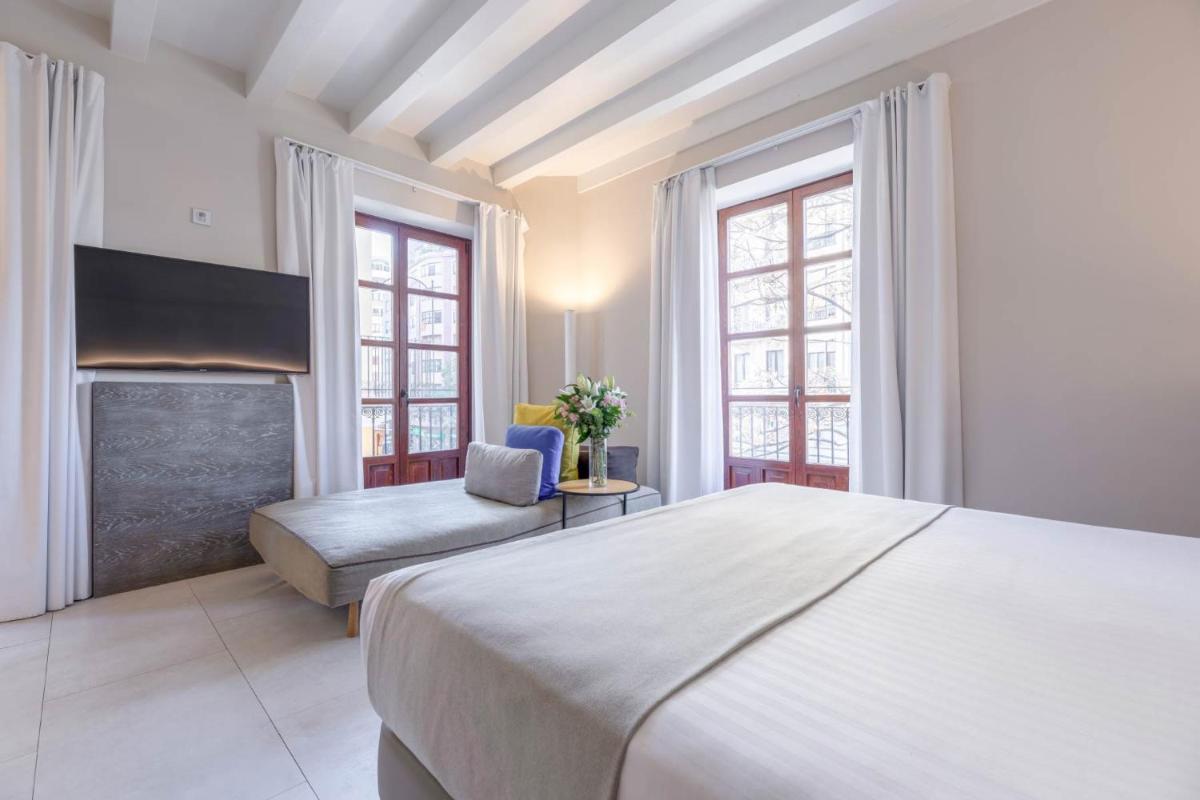 Cama o camas de una habitación en MYR Plaza Mercado & Spa