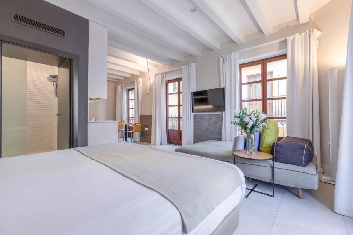 Cama o camas de una habitación en MYR Plaza Mercado & Spa