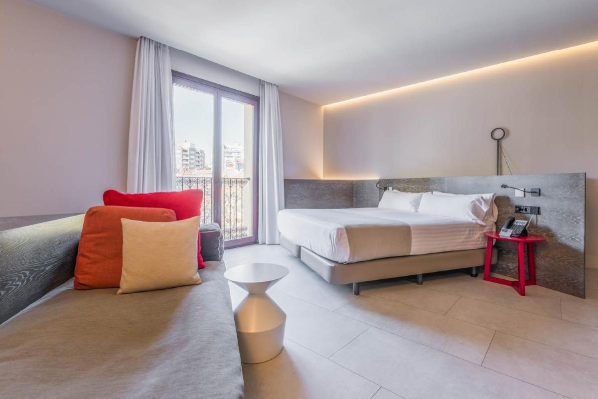 Cama o camas de una habitación en MYR Plaza Mercado & Spa