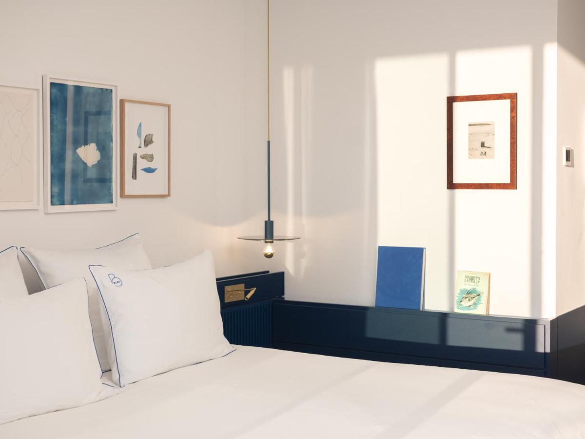 Un ou plusieurs lits dans un hébergement de l'établissement Bleu Hôtel & Spa