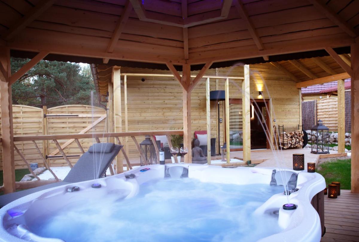 Photo de la galerie de l'établissement Domaine du Haut Jardin Hôtel & Chalets Spa Privé, à Rehaupal