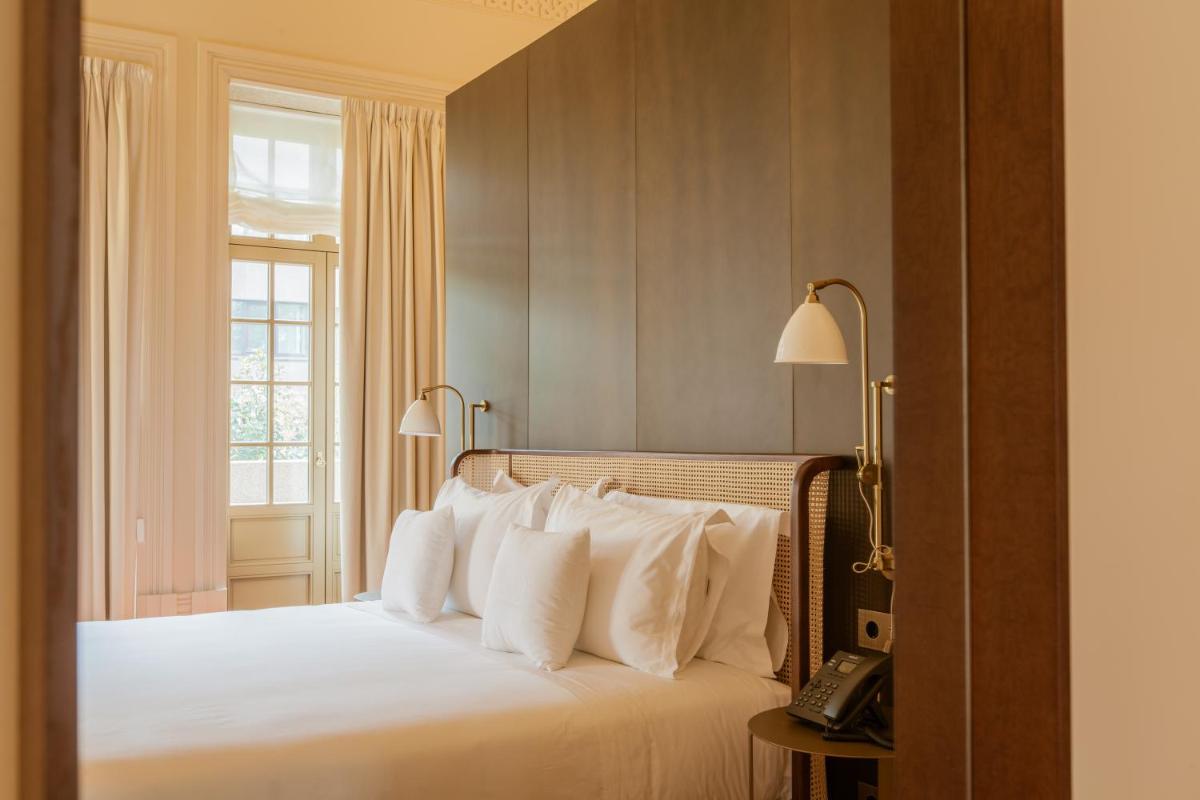 Uma cama ou camas num quarto em Palacete Severo