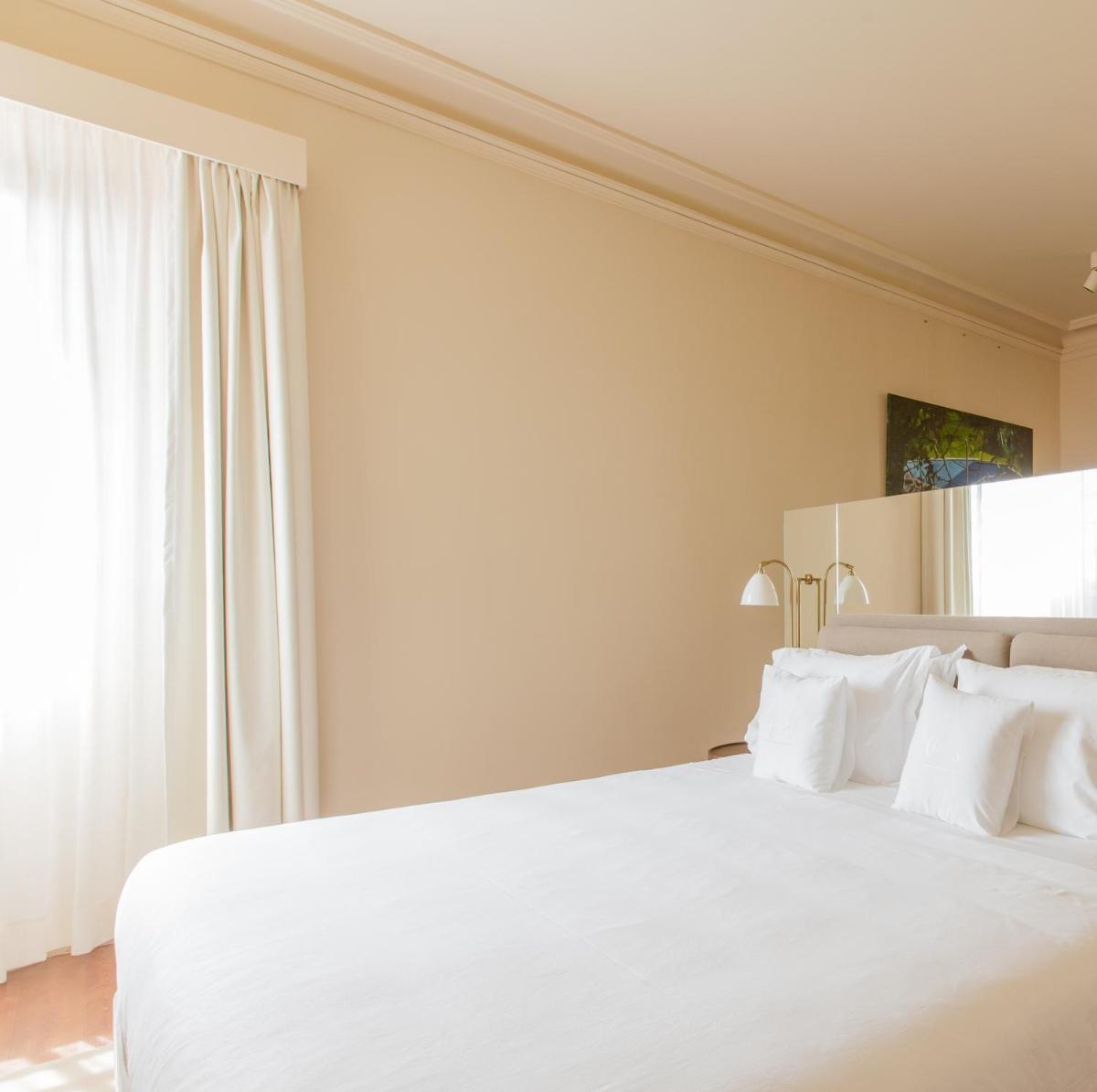 Uma cama ou camas num quarto em Palacete Severo