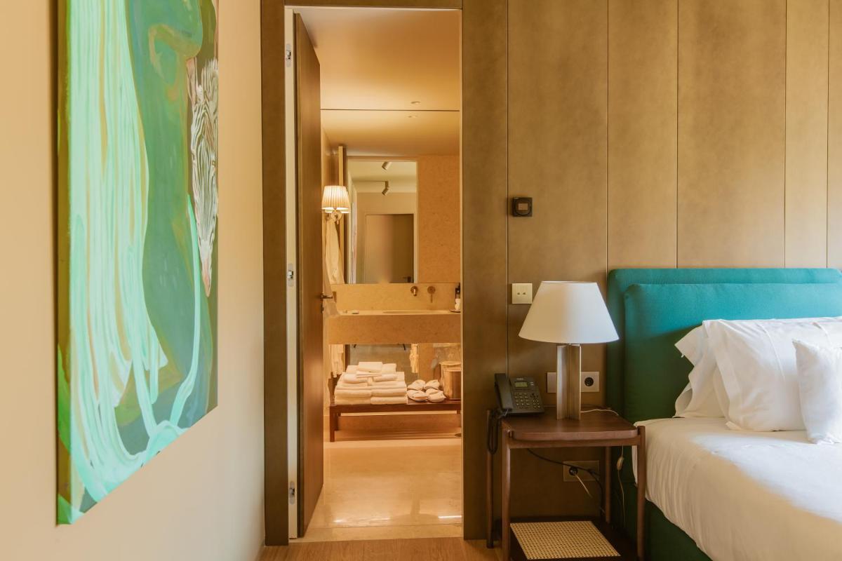 Uma cama ou camas num quarto em Palacete Severo