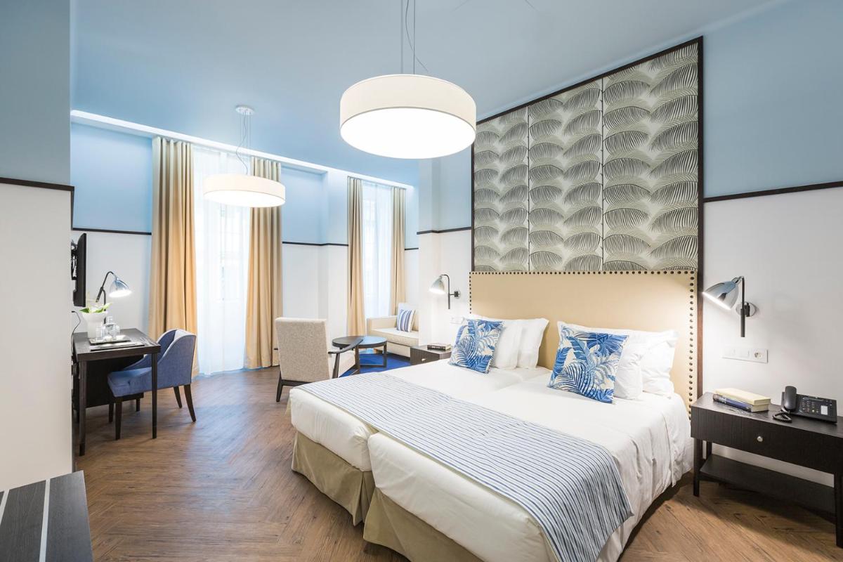 Uma cama ou camas num quarto em Castanheiro Boutique Hotel
