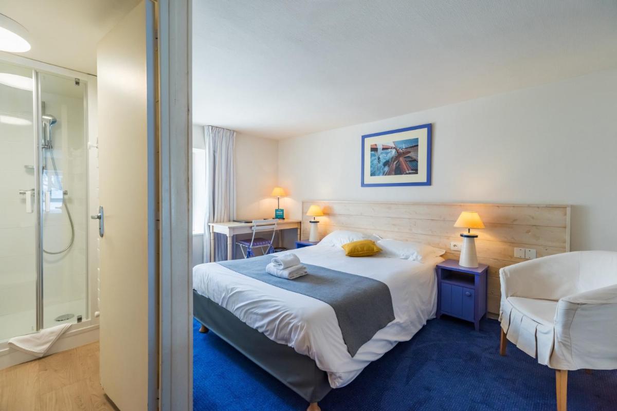 Un ou plusieurs lits dans un hébergement de l'établissement Hôtel Miléade de la Plage - Binic