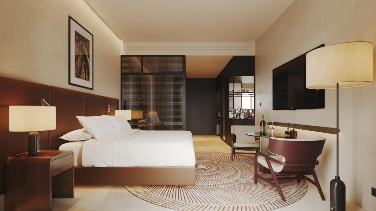 Uma cama ou camas num quarto em Tivoli Kopke Porto Gaia Hotel