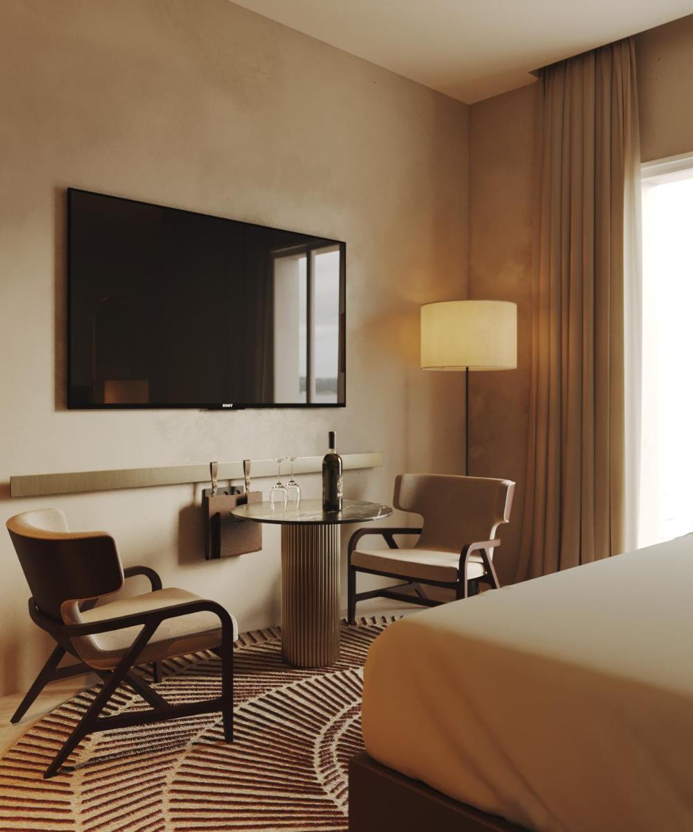 Uma cama ou camas num quarto em Tivoli Kopke Porto Gaia Hotel