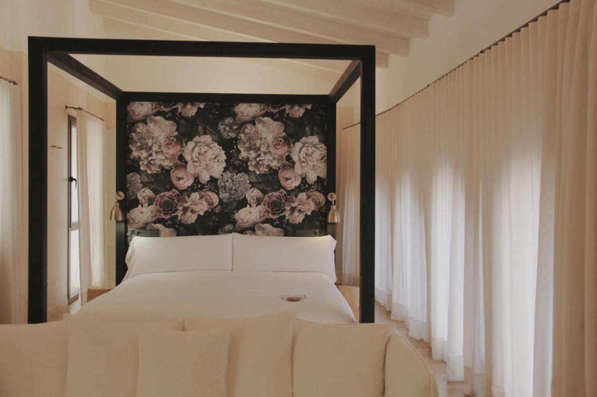 Cama o camas de una habitación en Hotel Palau Macelli & Spa