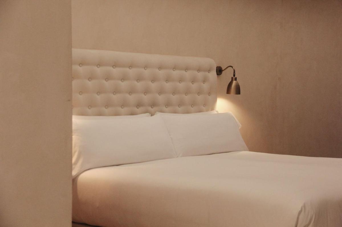 Cama o camas de una habitación en Hotel Palau Macelli & Spa