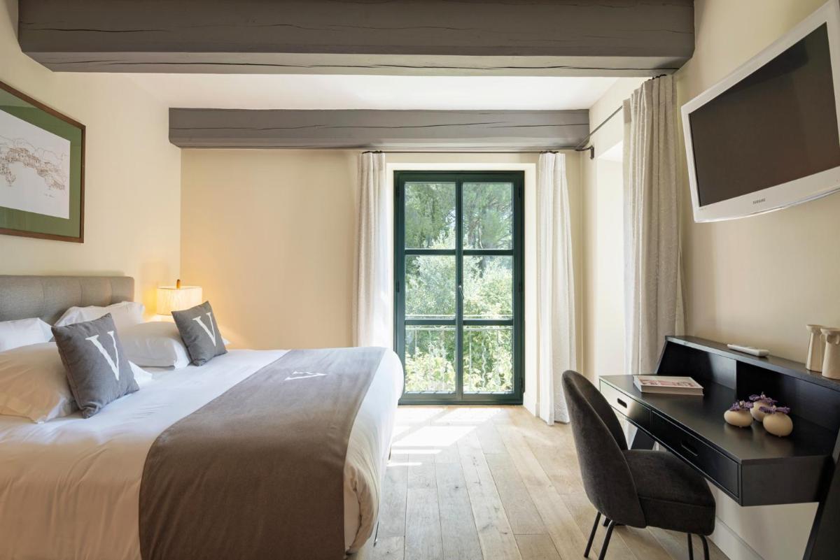 Un ou plusieurs lits dans un hébergement de l'établissement Le Vallon de Valrugues Hotel Spa & Villas