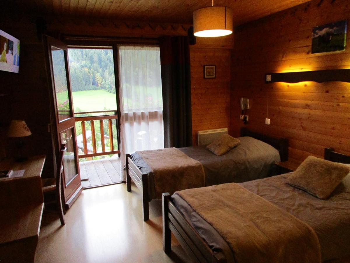 Un ou plusieurs lits dans un hébergement de l'établissement Hotel Le Ferraillon