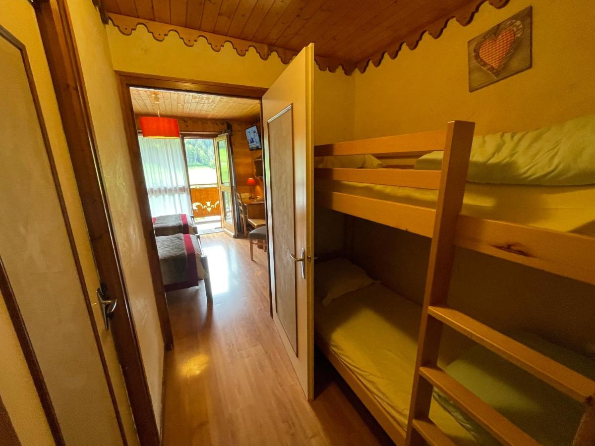 Un ou plusieurs lits dans un hébergement de l'établissement Hotel Le Ferraillon