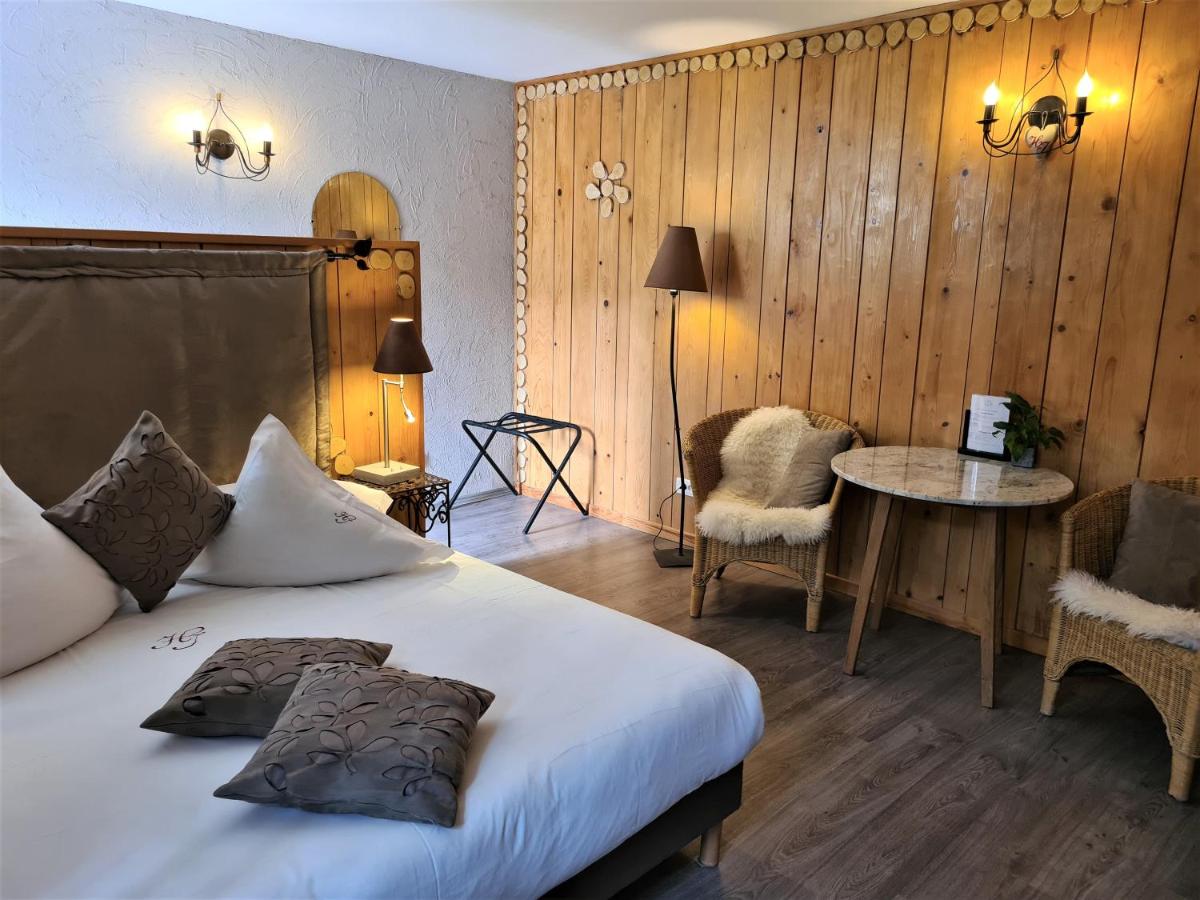 Un ou plusieurs lits dans un hébergement de l'établissement Domaine du Haut Jardin Hôtel & Chalets Spa Privé