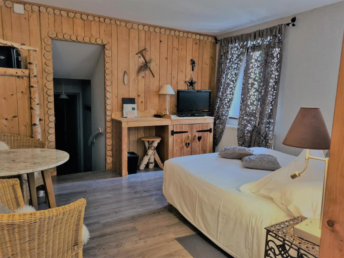 Un ou plusieurs lits dans un hébergement de l'établissement Domaine du Haut Jardin Hôtel & Chalets Spa Privé