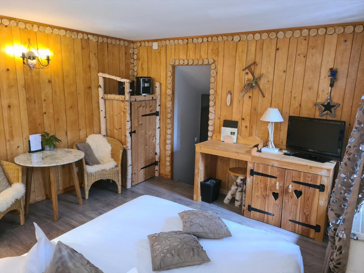 Un ou plusieurs lits dans un hébergement de l'établissement Domaine du Haut Jardin Hôtel & Chalets Spa Privé