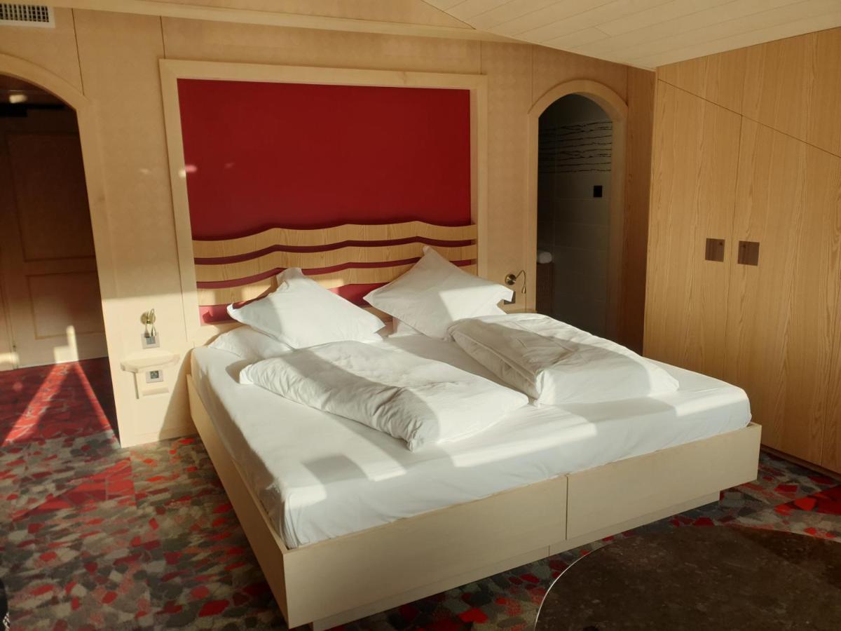 Un ou plusieurs lits dans un hébergement de l'établissement Domaine du Haut Jardin Hôtel & Chalets Spa Privé