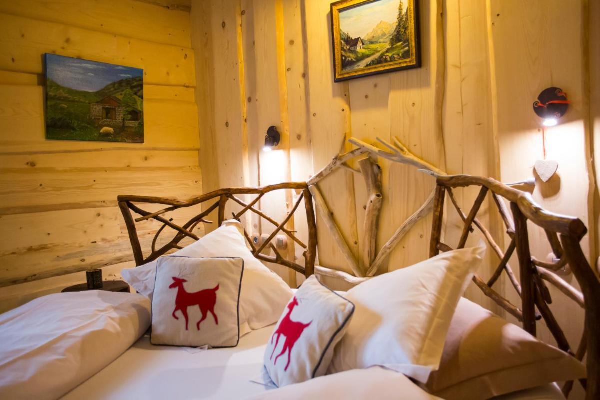 Un ou plusieurs lits dans un hébergement de l'établissement Domaine du Haut Jardin Hôtel & Chalets Spa Privé