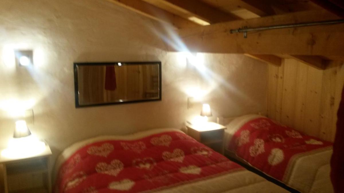 Un ou plusieurs lits dans un hébergement de l'établissement Apart'hotel & Spa "La Destière"