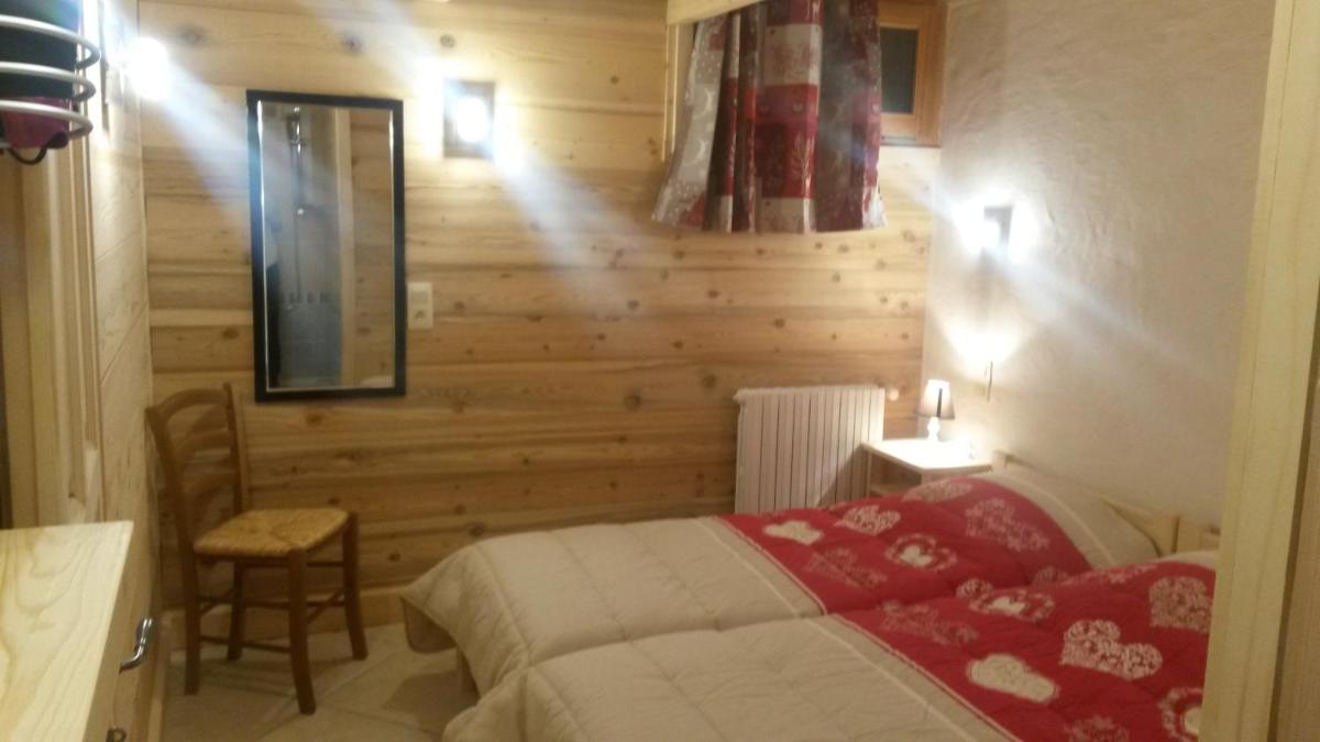 Un ou plusieurs lits dans un hébergement de l'établissement Apart'hotel & Spa "La Destière"