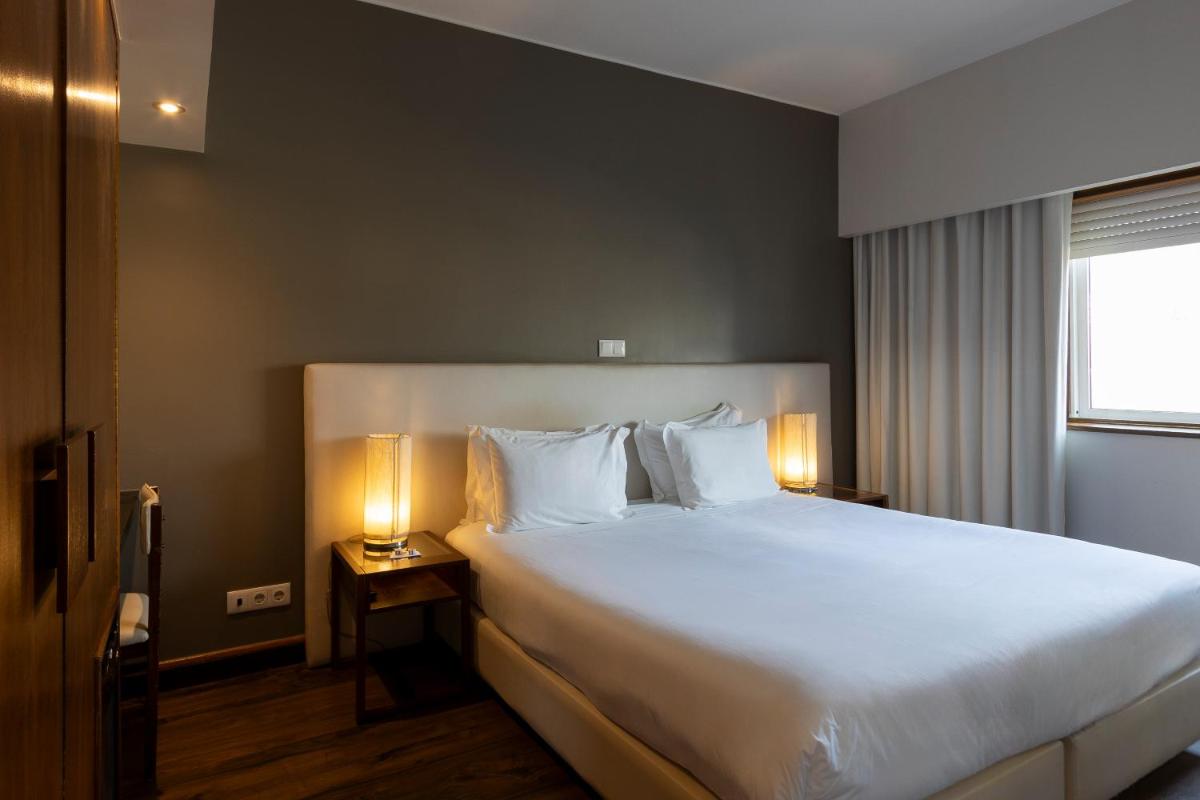 Uma cama ou camas num quarto em Hotel Rali Viana
