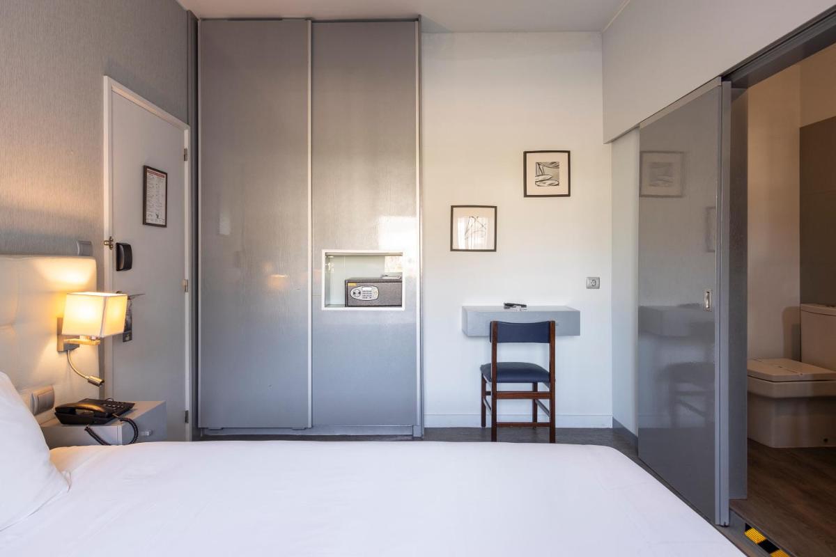 Uma cama ou camas num quarto em Hotel Rali Viana
