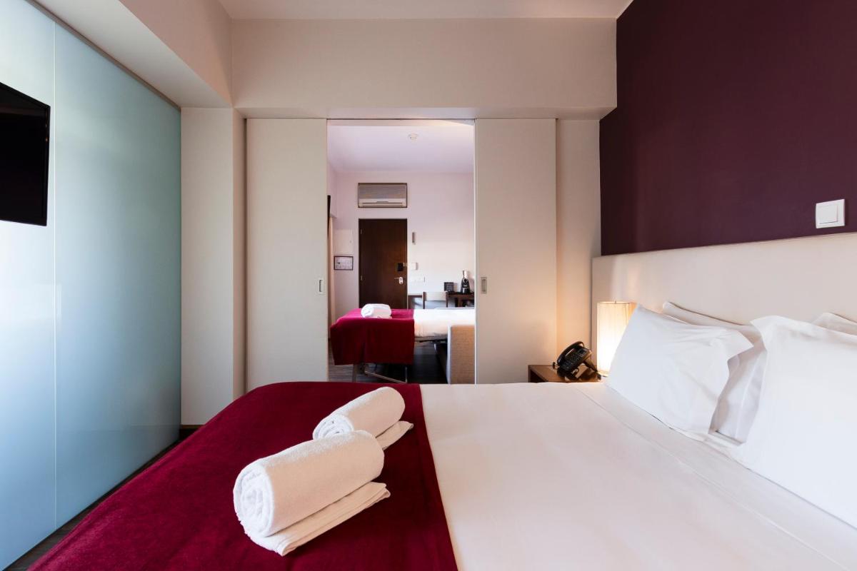 Uma cama ou camas num quarto em Hotel Rali Viana