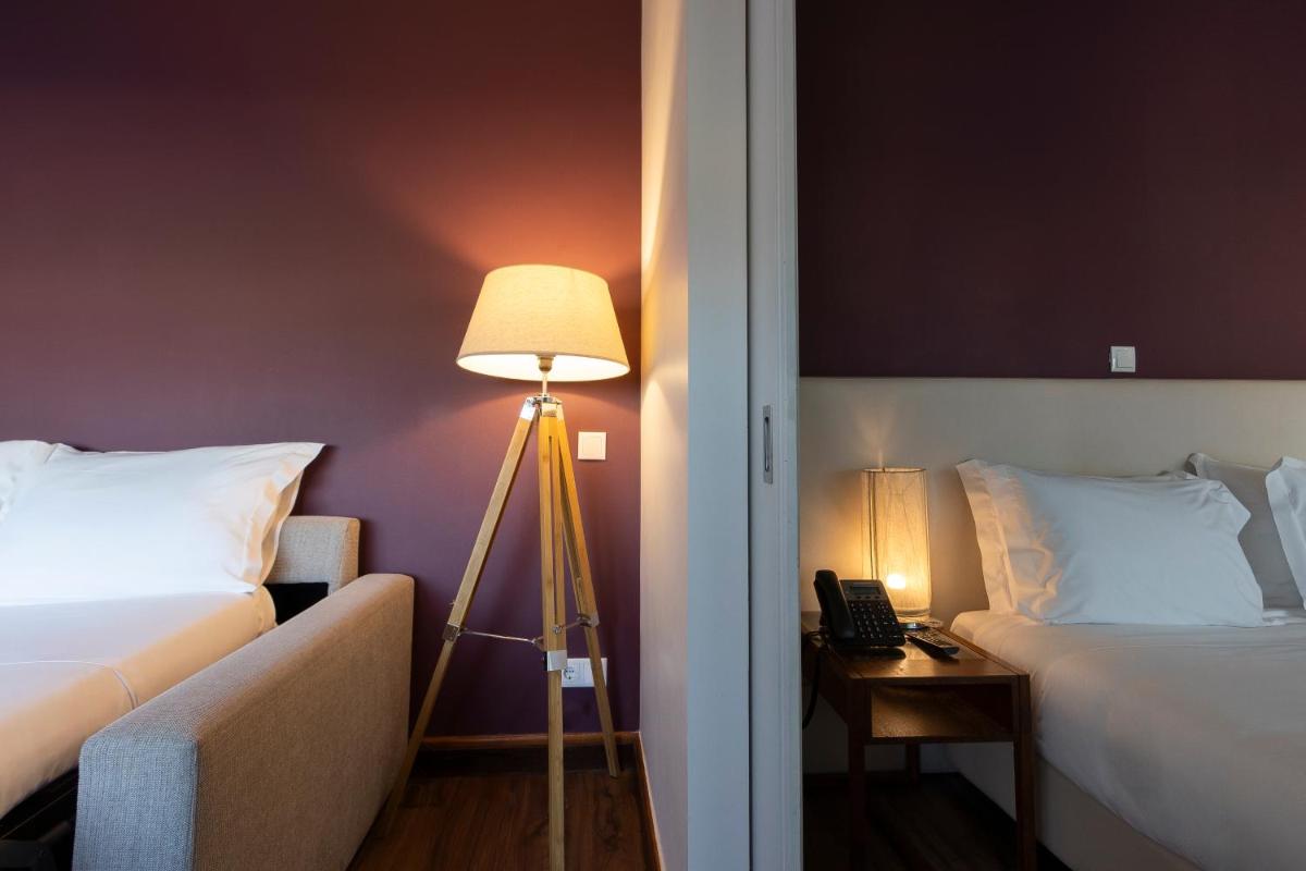 Uma cama ou camas num quarto em Hotel Rali Viana