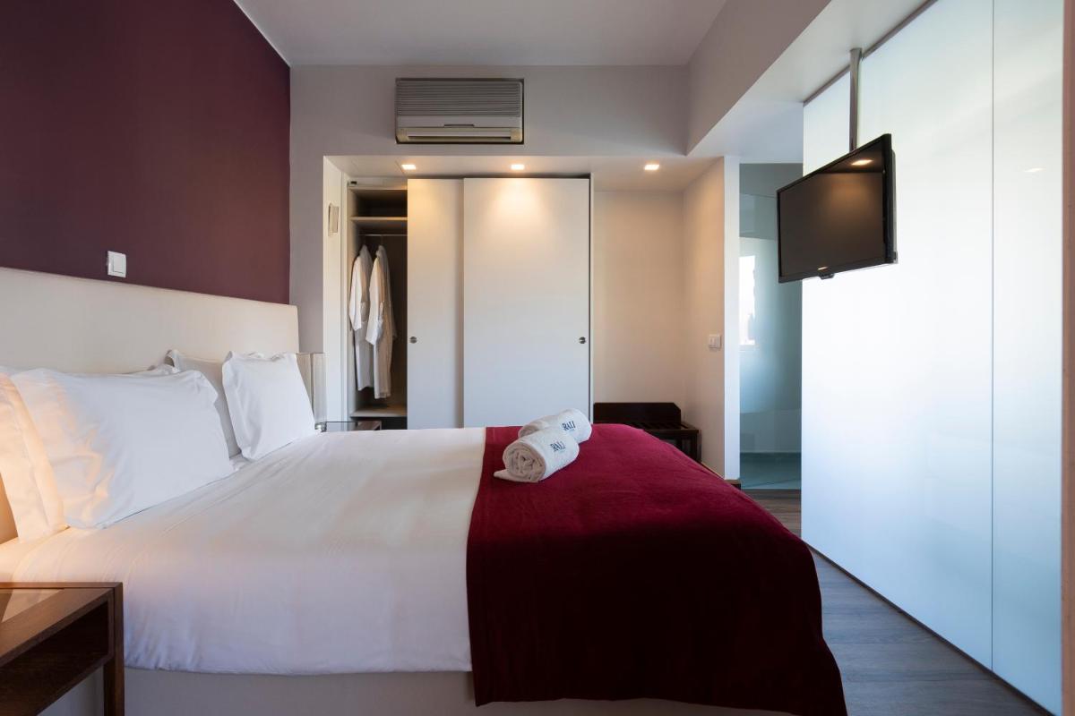 Uma cama ou camas num quarto em Hotel Rali Viana