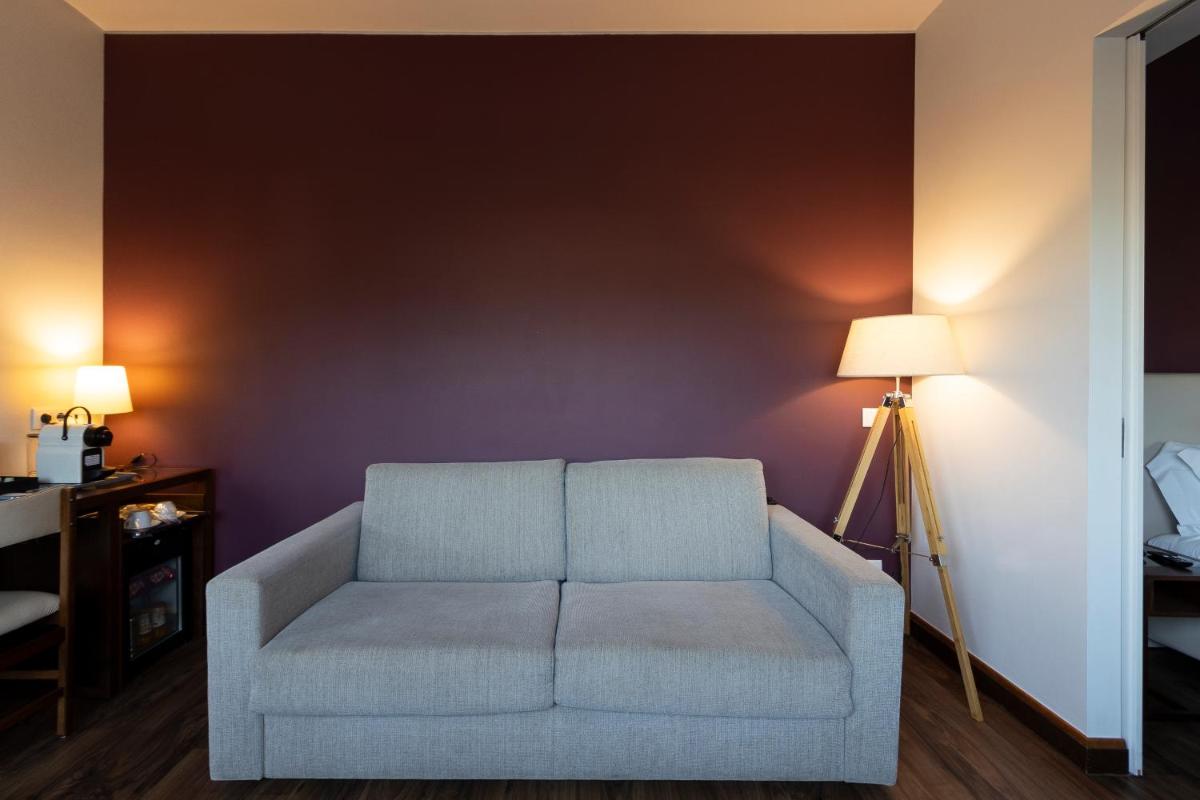 Uma área de estar em Hotel Rali Viana