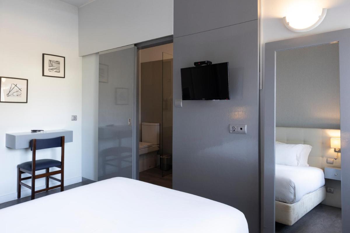 Uma cama ou camas num quarto em Hotel Rali Viana