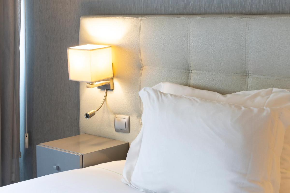 Uma cama ou camas num quarto em Hotel Rali Viana