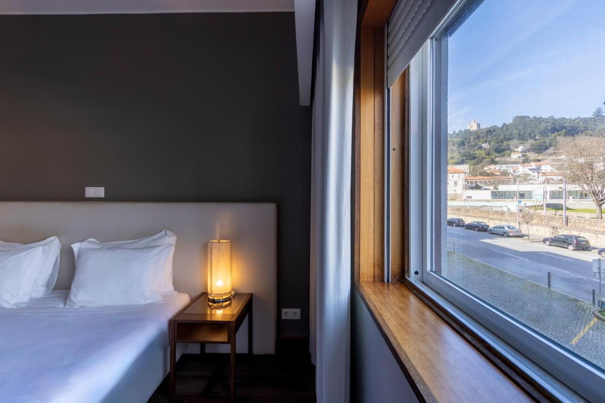 Uma cama ou camas num quarto em Hotel Rali Viana